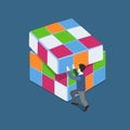 Flat 3d web isometric man plays with Rubik's Cube puzzle concept Royalty Free Stock Photo