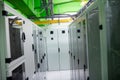 Flat design data center raised tiles aisle showing server cabinets running under overhead cabling Royalty Free Stock Photo
