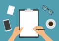 Flat design illustration of workspace on table top. Hand holding pencil and clipboard with blank white sheet of paper. Cup of Royalty Free Stock Photo