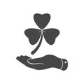 flat hand presenting Clover with three leaves sign icon on a white background. Saint Patrick symbol