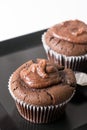 Flat lay above chocolate cup cake muffin on the black square plate Royalty Free Stock Photo