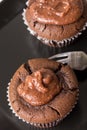 Flat lay above chocolate cup cake muffin on the black square plate Royalty Free Stock Photo