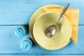 Flat lay above domestic soup bowl with metal spoon on the table with selective focus Royalty Free Stock Photo