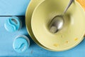 Flat lay above domestic soup bowl with metal spoon on the table with selective focus Royalty Free Stock Photo