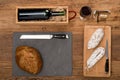 Flat lay above view of dry sausage delicatessen sliced meat with wine and traditional bread on wooden board