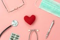 Flat lay aerial of accessories healthcare & medical background concept.Table top view red heart, stethoscope,medicine,face mask, Royalty Free Stock Photo