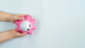 Flat lay antistress toy squish pink star in hands on Blue background.