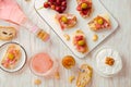 Flat lay of Appetizers and open sandwiches with Italian antipasti, camembert, Parma ham and rose wine