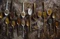 Flat Lay of Assorted Spices and Seeds in a Collection of Gold and Silver Spoons, ai generative