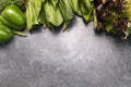 Flat Lay Assortment Of Fresh Organic Home Grown Green Vegetables On Gray Granite Table