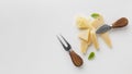 flat lay assortment gourmet cheese cheese knives with copy space. High quality beautiful photo concept Royalty Free Stock Photo