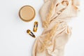 Flat lay autumn composition with cup of coffee, beige blanket, dry flowers and barrettes on white table. Top view cozy home Royalty Free Stock Photo