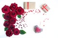 Flat Lay Background, flower pattern, the theme of lovers. Red roses and gifts with ribbons on a white background