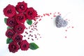 Flat Lay Background, flower pattern, Valentine`s Day, the theme of lovers. Red roses and gifts with ribbons on a white background