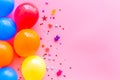 Flat lay with ballons - party concept - on pink background top-down copy space