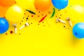 Flat lay with ballons - party concept - on yellow background top-down copy space Royalty Free Stock Photo