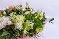 Flat lay of a beautiful florish bouquet composition on the white background