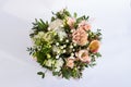 Flat lay of a beautiful florish bouquet composition on the white background