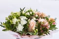 Flat lay of a beautiful florish bouquet composition on the white background