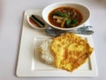 Flat lay beef spicy red soup with rice and omelette