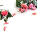 Flat lay: Bible and pink, red, rose flower bouquet. On white background