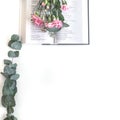 Flat lay: Bible and pink, red, rose flower bouquet. On white background Royalty Free Stock Photo