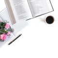 Flat lay: Bible and pink, red, rose flower bouquet. On white background