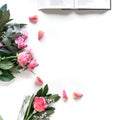 Flat lay: Bible and pink, red, rose flower bouquet. On white background Royalty Free Stock Photo