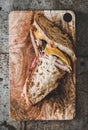 Flat-lay of pastrami sandwich slices in sourdough bread with cheese Royalty Free Stock Photo