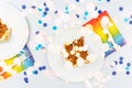 Flat lay with birthday cake pieces on white paper plates. Birthday party celebration concept Royalty Free Stock Photo