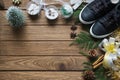 Flat lay black sneaker, mini christmas tree, gold and silver bow
