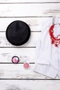 Flat lay black women hat and cosmetic powder. Royalty Free Stock Photo