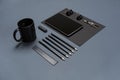 Flat lay of blank black paper sheet, black stationery items and coffee cup on gray desktop. Mock up Royalty Free Stock Photo