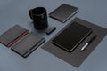 Flat lay of blank black paper sheet, black stationery items and coffee cup on gray desktop. Mock up Royalty Free Stock Photo