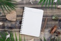 Flat lay blank notepad with heart shape rock, shells, palm leaves and air plane model. Holiday tropical beach travel vacation Royalty Free Stock Photo