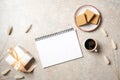 Flat lay of blank paper notepad with copy space mock up. Top view home office desk workspace decorated with dry flowers, gift box Royalty Free Stock Photo