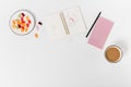 Flat lay blogger workspace mockup with notepad, paper clips, pencil , coffee and sweets on white background. Copy space Royalty Free Stock Photo