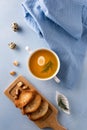 Flat lay with bouillon, textile and toasted bread Royalty Free Stock Photo