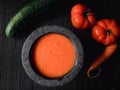 Flat lay of a bowl of Gazpacho - Spanish tomato soup,  and vegetables Royalty Free Stock Photo