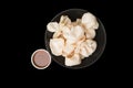 Flat lay of a bowl of shrimp chips and sauce