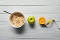 Breakfast cereal in bowl, apple, orange
