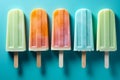 Flat lay of bright ice cream popsicles, top view on blue