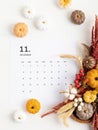 Flat lay with calendar for november with autumn table decoration