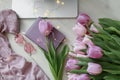 Flat Lay canddle Laptop plaid, pink Tulips White Surface Royalty Free Stock Photo