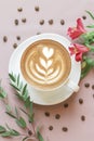 Flat Lay with Cappuccino, Flowers and Coffee Beans