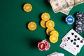 Flat lay Casino, night life, online gambling business games. Chips, cards and dollars on a green table with space