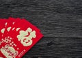 Flat lay Chinese new year red envelope on dark wooden background Royalty Free Stock Photo