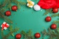 Christmas composition with festive decor and gift boxes on color background