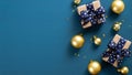 Flat lay Christmas gift boxes, golden balls, confetti, ribbon over blue background. Christmas banner mockup with copy space, Royalty Free Stock Photo