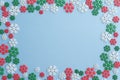 Flat lay of Christmas snowflake border frame on blue background with copy space. Christmas composition for your creative design Royalty Free Stock Photo